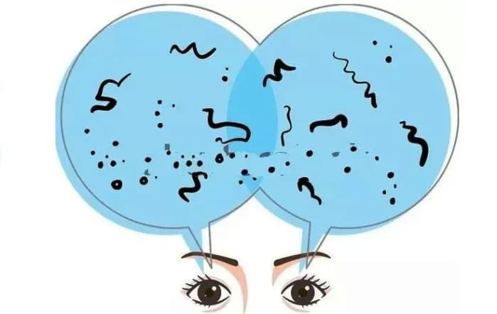 Illustration of eyes looking through blue circles filled with black squiggles and dots representing floaters.
