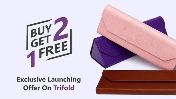 Banner advertising ‘Exclusive Launching Offer On Trifold, Buy 2 Get 1 Free’ featuring three pastel-coloured Specscart trifold cases in pink, purple, and brown, arranged in pairs on a pale background.