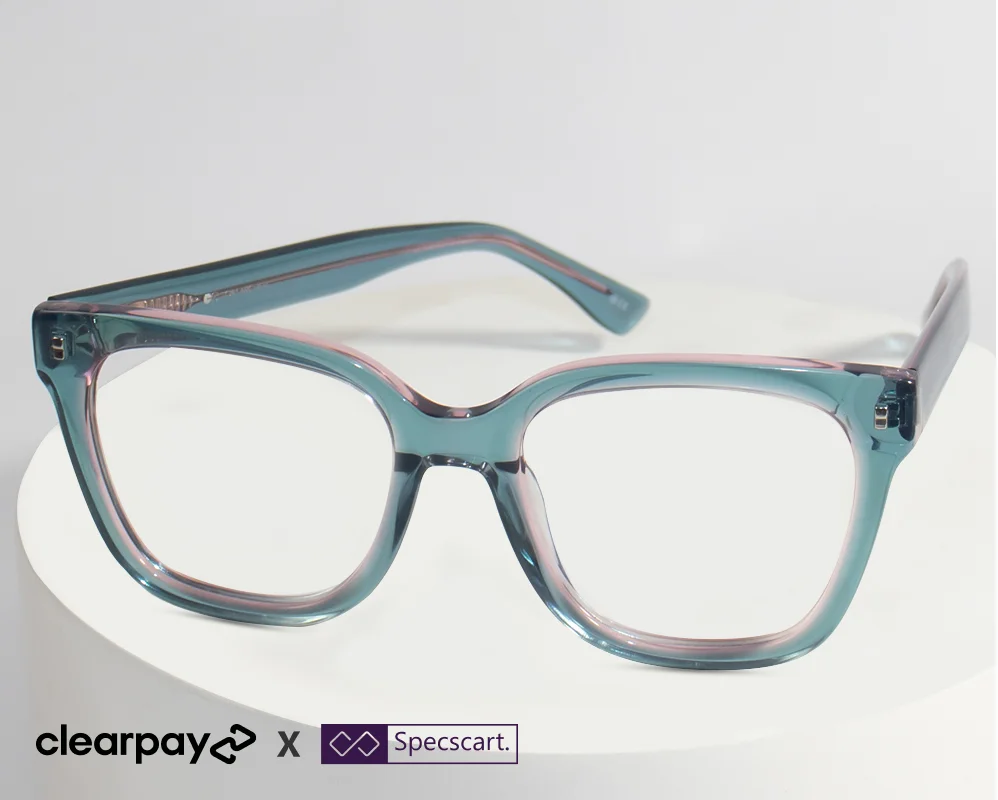 Transparent rectangular glasses in teal blue acetate, displayed on a white circular stand. The image features the Clearpay logo and Specscart branding in the bottom left corner, highlighting their partnership.