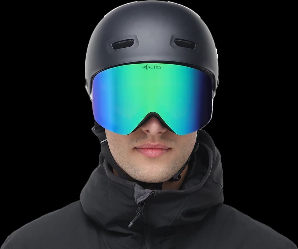 falcon 2 Front view of the Specscart Falcon ski goggles for amateur skiers, featuring a blue-green mirrored lens, black frame accented with Actics branding, worn with a matte black ski helmet and zipped black winter jacket.