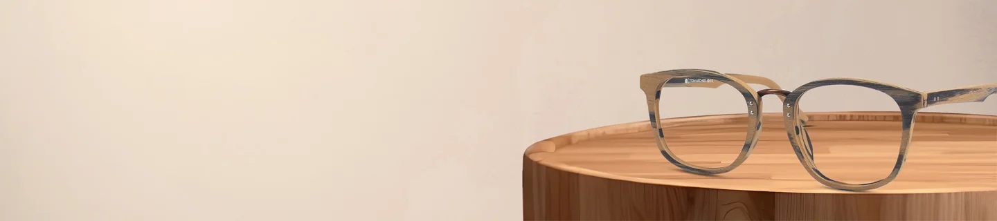 Wooden Glasses Round wooden-finish glasses resting on a polished timber stump, showcasing the natural grain texture and eco-friendly style of the frames.