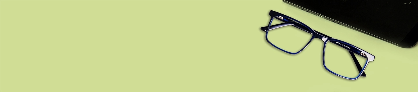 Affordable Glasses Blue rectangular glasses frames placed on a lime green desk next to a laptop, showcasing stylish and affordable eyewear for daily work.