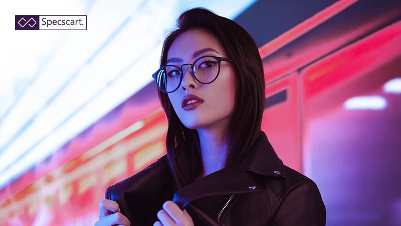 What Are Asian Fit Glasses Frames and Who Should Use Them? An Asian model wearing round black frames designed with a low bridge fit for comfort and a secure, non-slip grip.