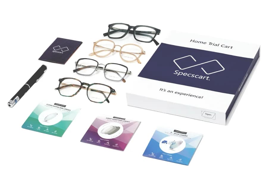 Specscart Free Home Trial: An assortment of eyeglasses, lenses, a UV pen, and a box with trial materials, illustrating the 4 frames, 3 lenses, and UV pen offer for 7 days.