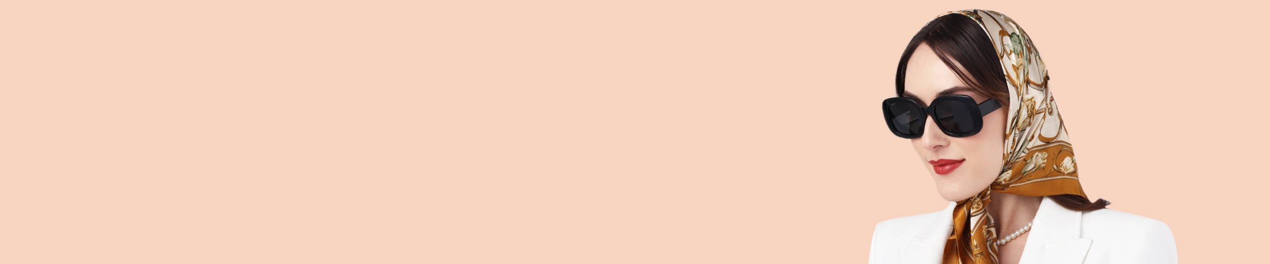 Black Sunglasses Specscart black sunglasses banner featuring a stylish woman wearing oversized black frames with a silk headscarf and white blazer.