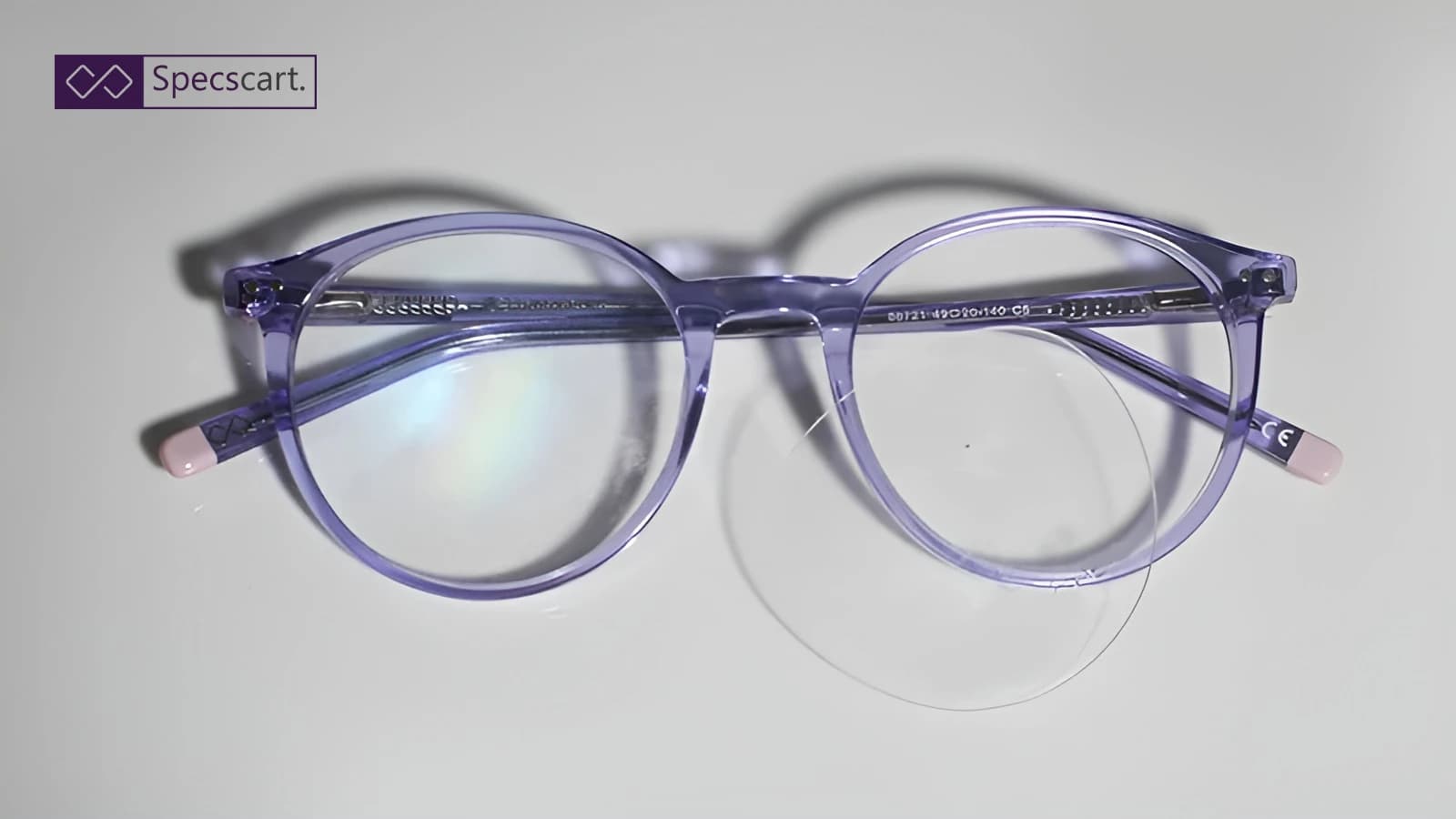 How to Fix Popped-Out Glasses Lenses? A pair of stylish, round purple eyeglasses with one lens completely popped out of the frame, illustrating the common issue of loose or popped-out lenses.