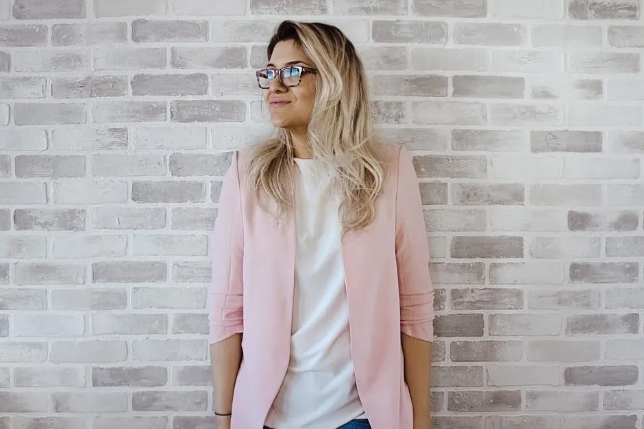 Hipster fashion women in bright clothes, heart shaped glasses