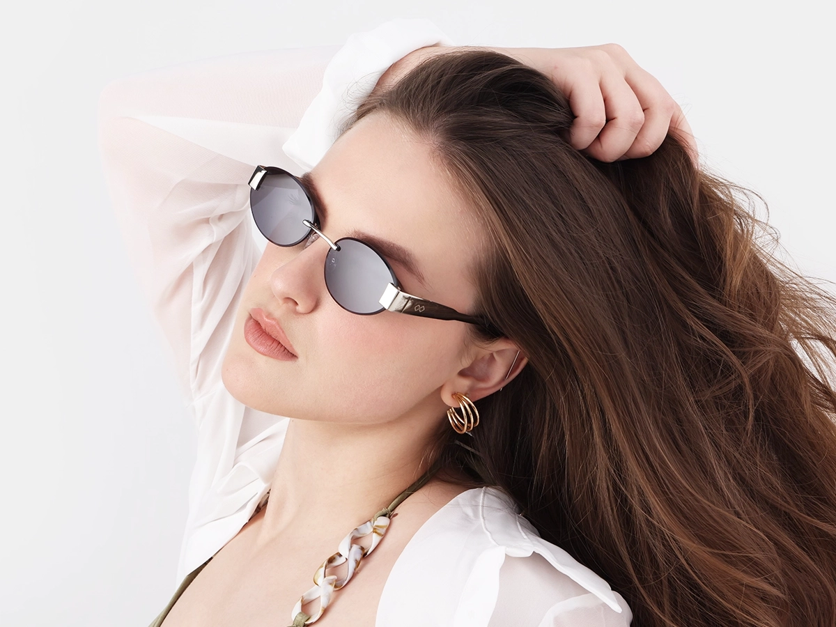 Oval Silver Rimless Sunglasses With Blue Tint-1