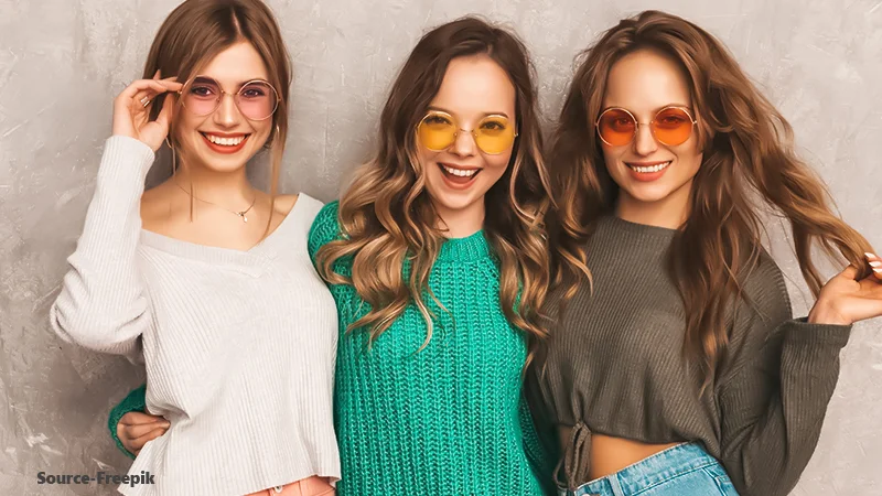 An image
of four women wearing tansitions glasses