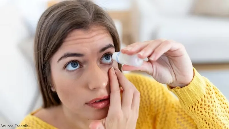 Image of a woman pouring eye drops in her eyes