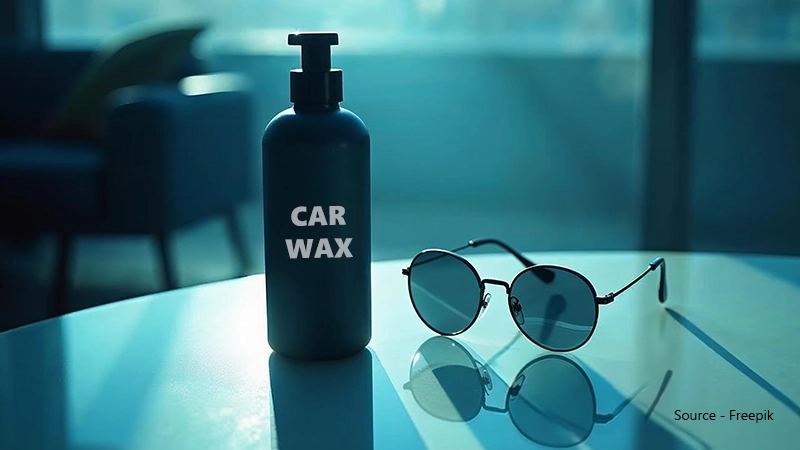 Applying car wax to remove scratches from sunglasses